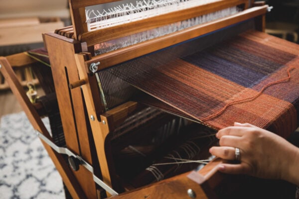 Weaving double weave blanket of a floor loom