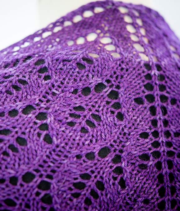 close up of purple leaf lace on knit shawl